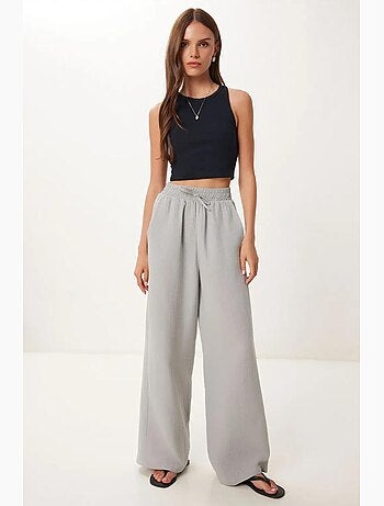 Pantalon jambes larges, taille élastique, cordon de serrage, finitions bordées istanbul