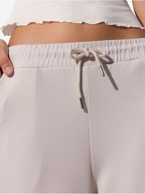 Pantalon long côtelé à taille élastiquée avec cordon de serrage busem - Kiabi Pantalon long côtelé à taille élastiquée avec cordon de serrage busem - Kiabi