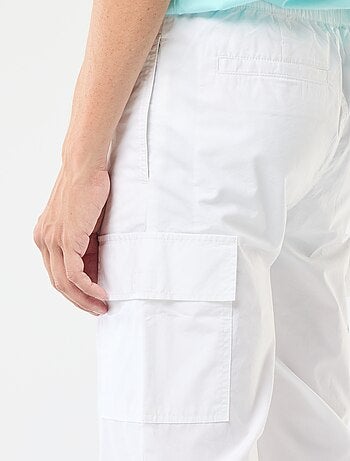 Pantalon multipoches avec ceinture élastiquée + cordons