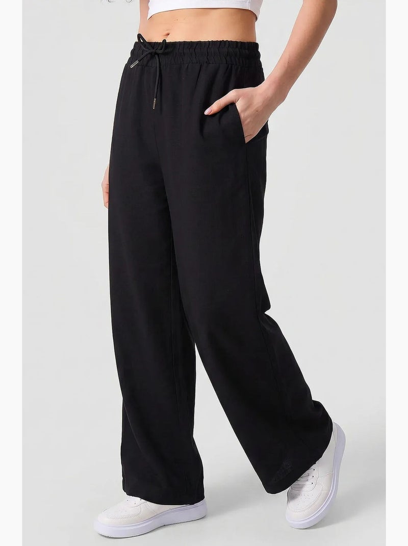 Pantalon palazzo avec cordon de serrage tommy Noir - Kiabi