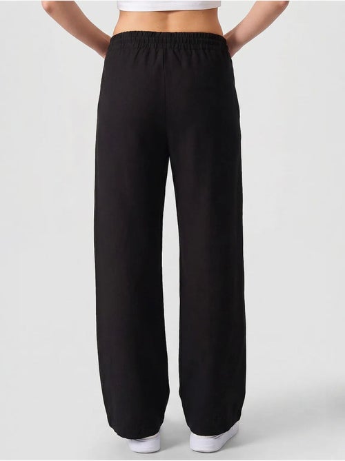 Pantalon palazzo avec cordon de serrage tommy - Kiabi Pantalon palazzo avec cordon de serrage tommy - Kiabi