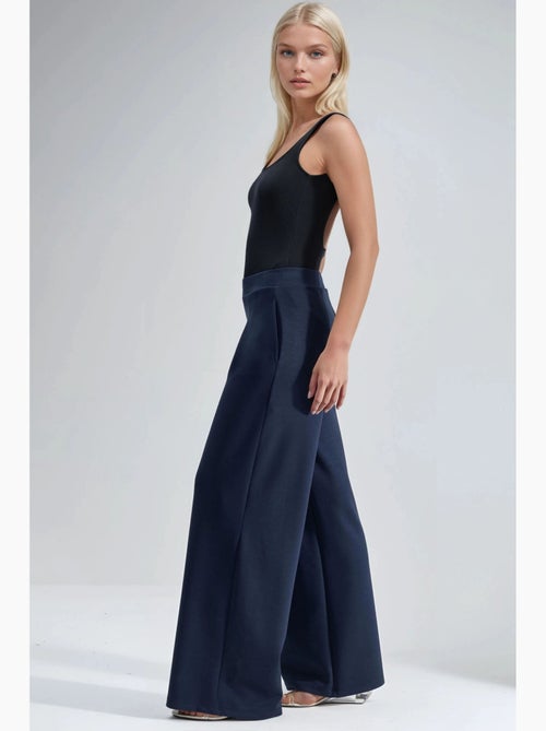 Pantalon palazzo taille haute avec élastique busem - Kiabi Pantalon palazzo taille haute avec élastique busem - Kiabi