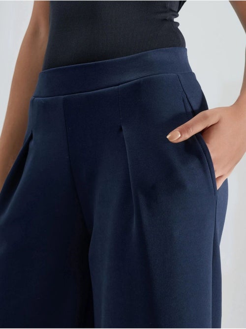 Pantalon palazzo taille haute avec élastique busem - Kiabi Pantalon palazzo taille haute avec élastique busem - Kiabi