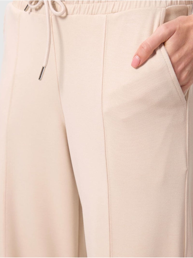 Pantalon palazzo texturé à jambes larges avec cordon de serrage à la taille tommy Beige argile - Kiabi