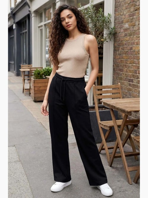 Pantalon palazzo texturé à jambes larges avec cordon de serrage à la taille tommy - Kiabi Pantalon palazzo texturé à jambes larges avec cordon de serrage à la taille tommy - Kiabi