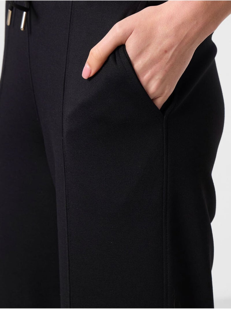 Pantalon palazzo texturé à jambes larges avec cordon de serrage à la taille tommy Noir - Kiabi