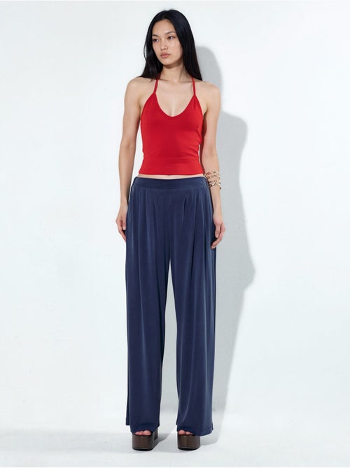 Pantalon plissé taille haute à jambes larges busem - Kiabi Pantalon plissé taille haute à jambes larges busem - Kiabi