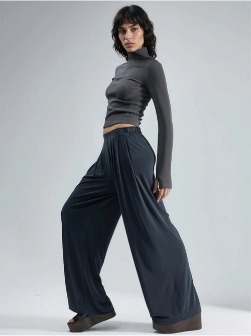 Pantalon plissé taille haute à jambes larges busem - Kiabi Pantalon plissé taille haute à jambes larges busem - Kiabi