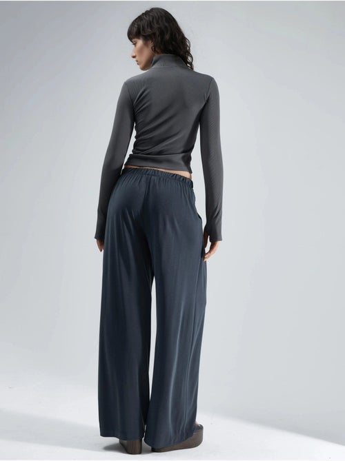 Pantalon plissé taille haute à jambes larges busem - Kiabi Pantalon plissé taille haute à jambes larges busem - Kiabi