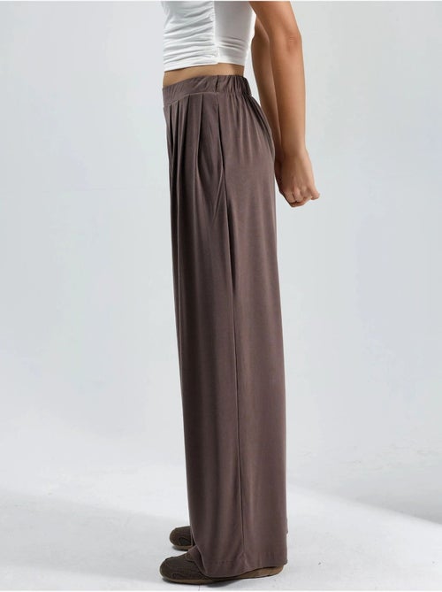 Pantalon plissé taille haute à jambes larges busem - Kiabi Pantalon plissé taille haute à jambes larges busem - Kiabi