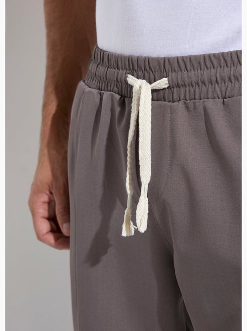 Pantalon sportswear en maille, élastiqué - AFIBEL - Kiabi Pantalon sportswear en maille, élastiqué - AFIBEL - Kiabi