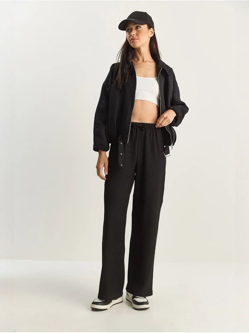 Pantalon taille haute à jambes larges en seersucker lucci Noir - Kiabi