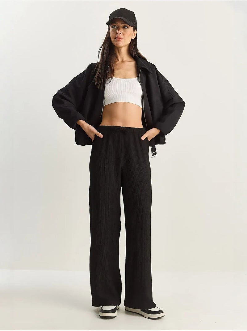 Pantalon taille haute à jambes larges en seersucker lucci Noir - Kiabi