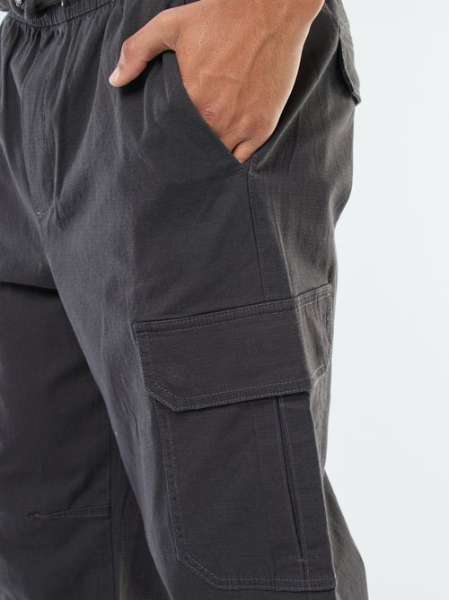 Pantalon uni multipoches avec taille élastiquée - Kiabi