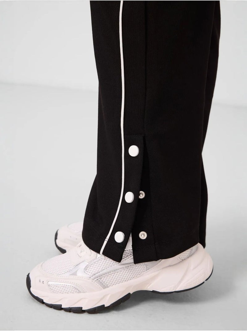 Pantalon unisexe jeunesse à jambe large tommy Noir - Kiabi