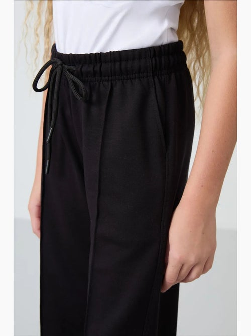 Pantalon unisexe junior en mélange de coton tommy - Kiabi Pantalon unisexe junior en mélange de coton tommy - Kiabi