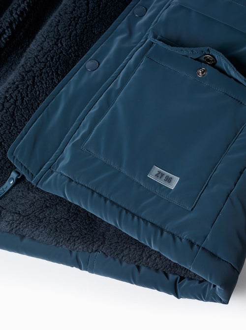 Parka Caoutchoutée avec Capuche et Doublure en Sherpa - Kiabi