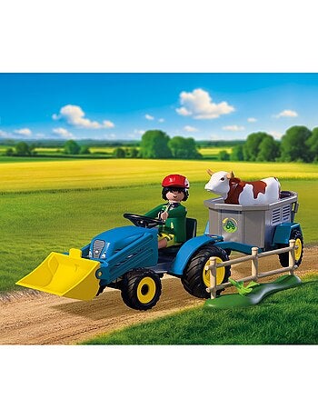 Petit tracteur avec andaineur à foin