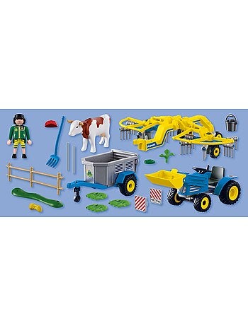 Petit tracteur avec andaineur à foin