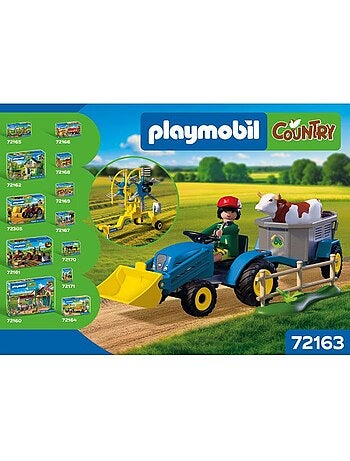 Petit tracteur avec andaineur à foin