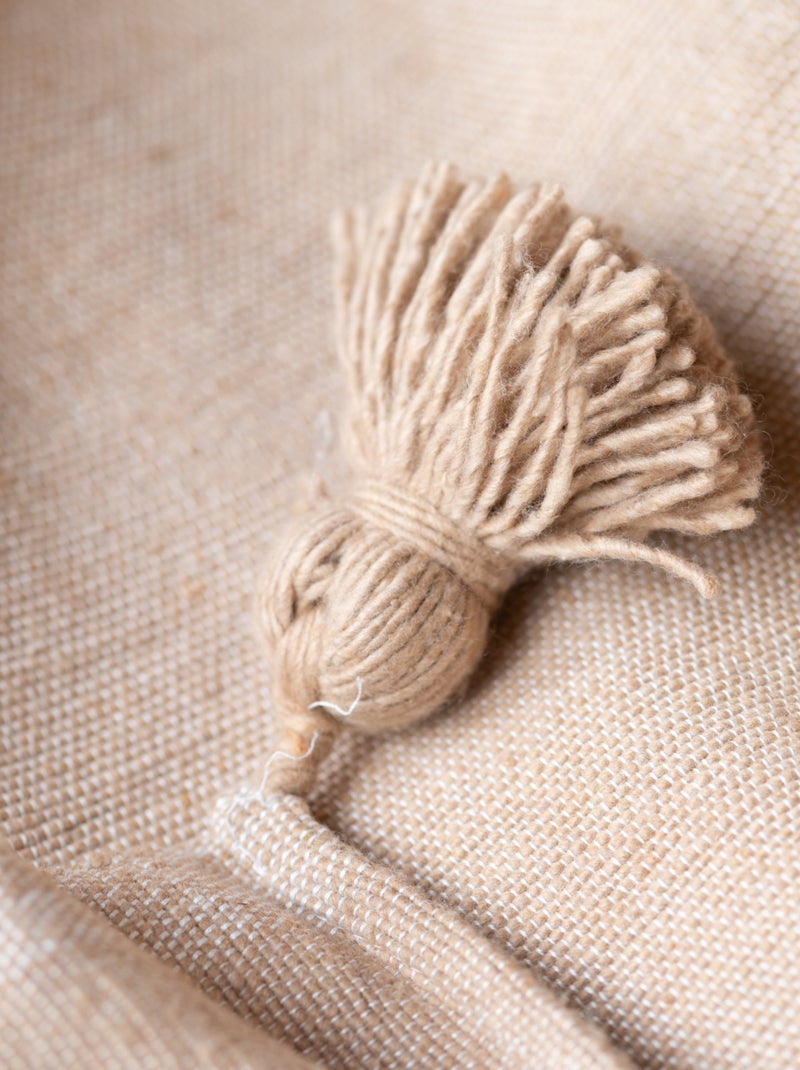 Plaid ou jeté de lit laine à pompons Beige - Kiabi