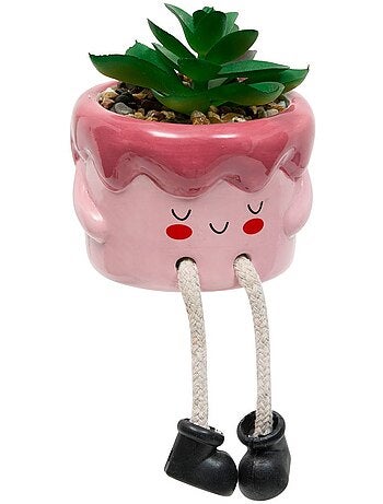 Plante artificielle en pot en céramique avec visage