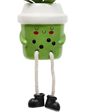 Plante artificielle en pot en céramique avec visage