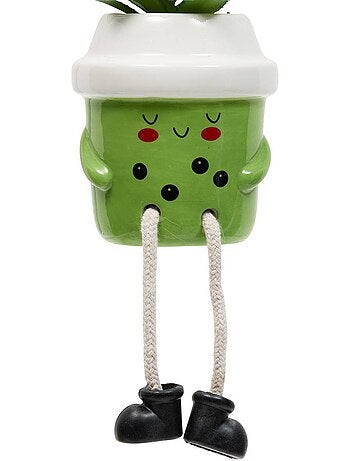 Plante artificielle en pot en céramique avec visage