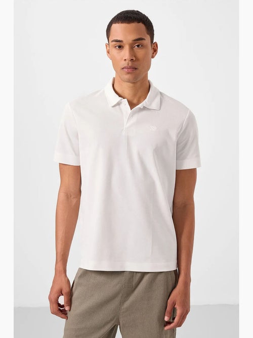 Polo coton élasthanne tommy - Kiabi Polo coton élasthanne tommy - Kiabi