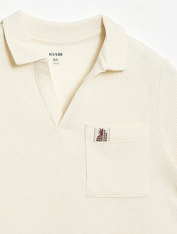 Polo en matière en nid d'abeilles
