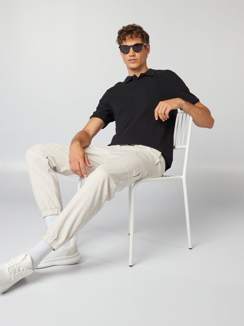 Polo homme en maille piquée à manches courtes Noir - Kiabi