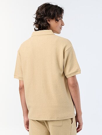 Polo matière fantaisie à manches courtes
