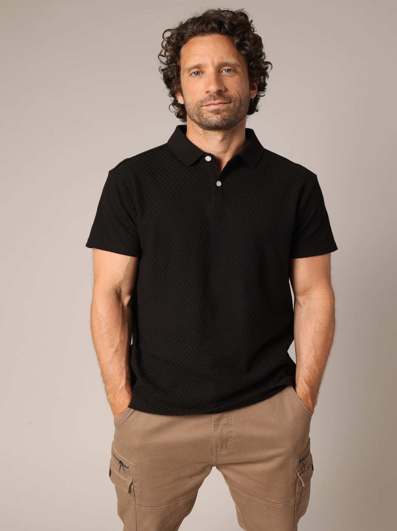 Polo noir homme en maille texturée, col classique et coupe élégante. 'Deeluxe' Noir - Kiabi