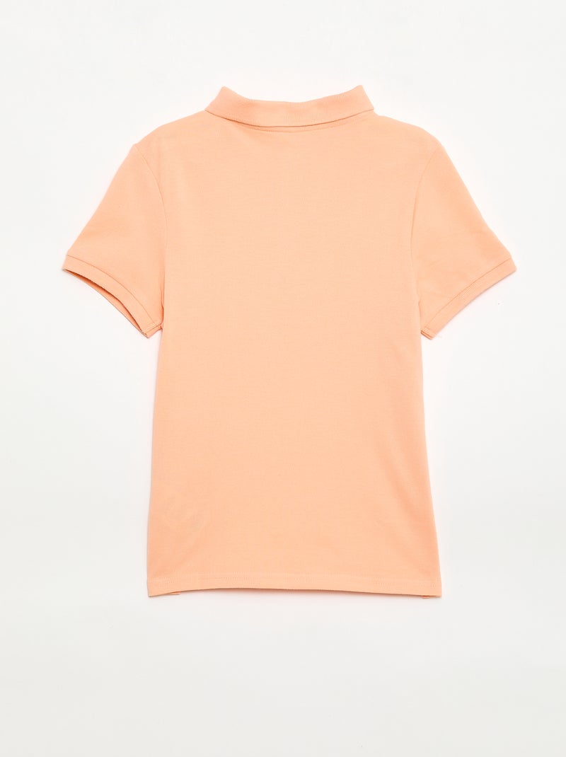 Polo uni en maille piquée Pêche - Kiabi