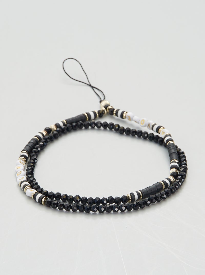Porte de téléphone avec des perles noir/blanc - Kiabi