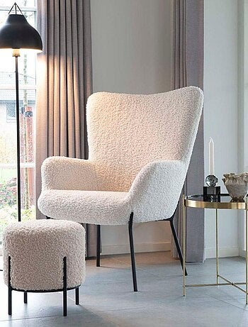 Pouf en fausse peau d'agneau blanc aux pieds noirs - House Nordic