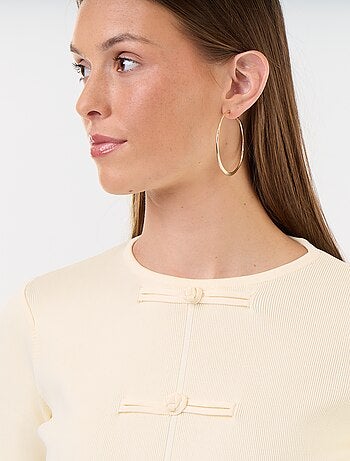 Pull avec détails mandarins