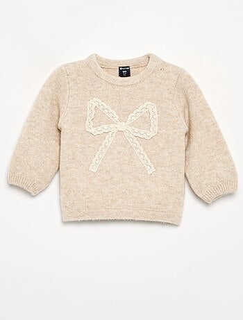 Pull avec grand nœud en dentelle