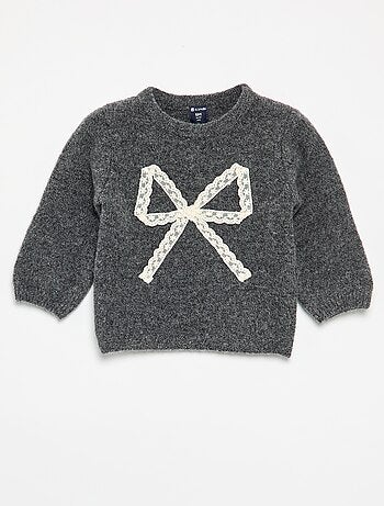 Pull avec grand nœud en dentelle