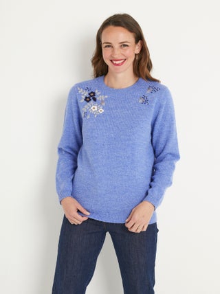 Pull doux uni brodé col rond manches longues