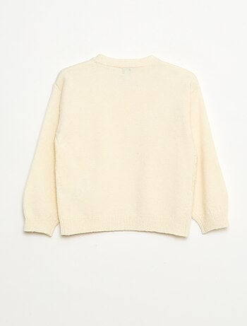 Pull en maille avec nœud en maille torsade devant