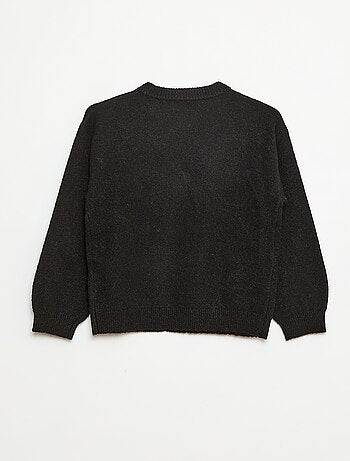 Pull en maille avec nœud en maille torsade devant