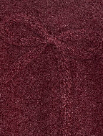 Pull en maille avec nœud en maille torsade devant