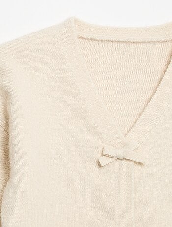 Pull en maille avec ouverture par nœuds
