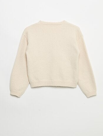 Pull en maille avec ouverture par nœuds