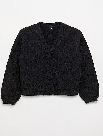 Pull en maille avec ouverture par nœuds