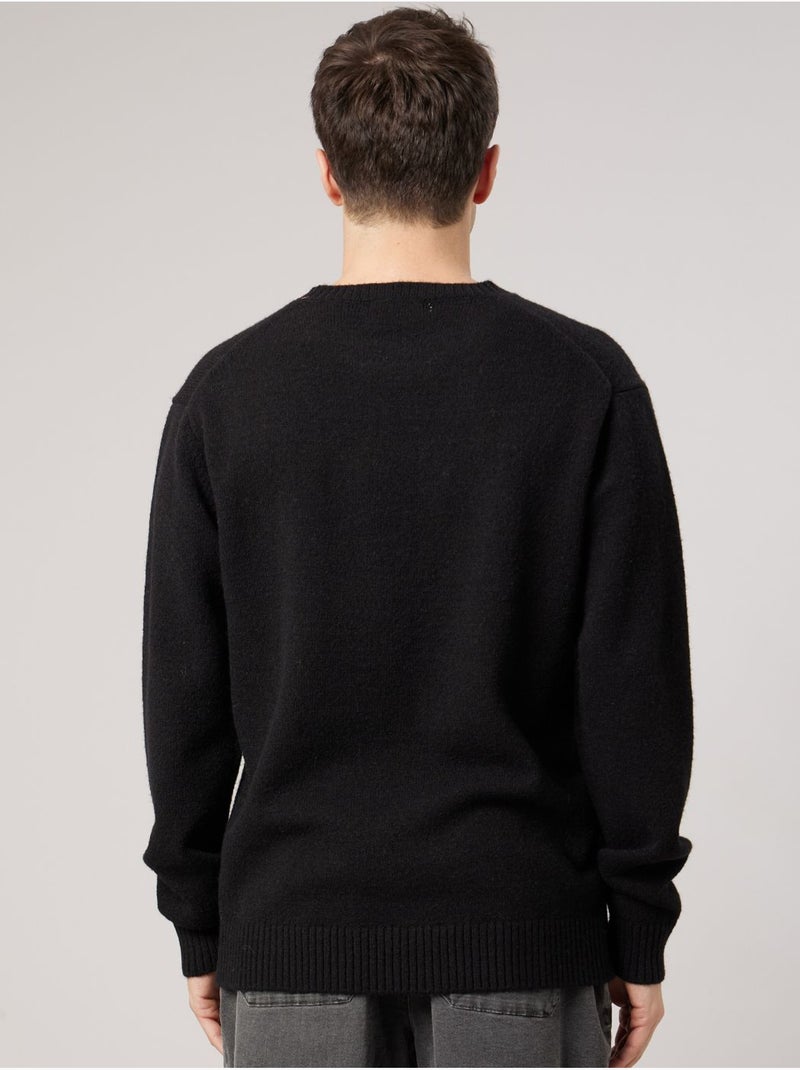 Pull homme avec étoile contrastée 'deeluxe' Noir - Kiabi