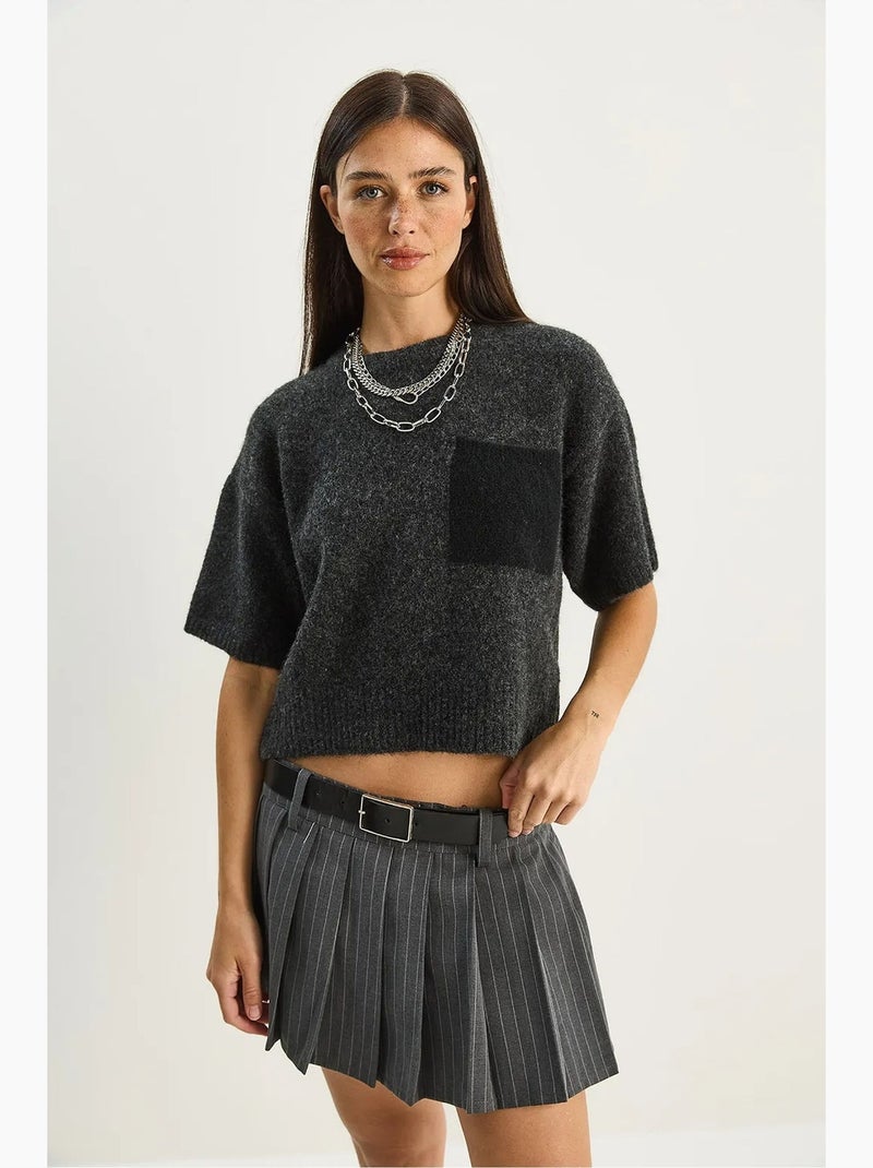 Pull oversize à col rond et poche lucci Gris Noir - Kiabi