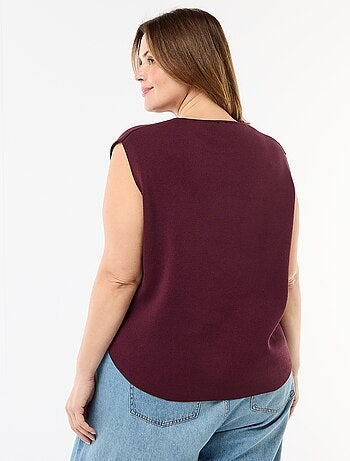 Pull sans manches avec boutons dorés sur côté