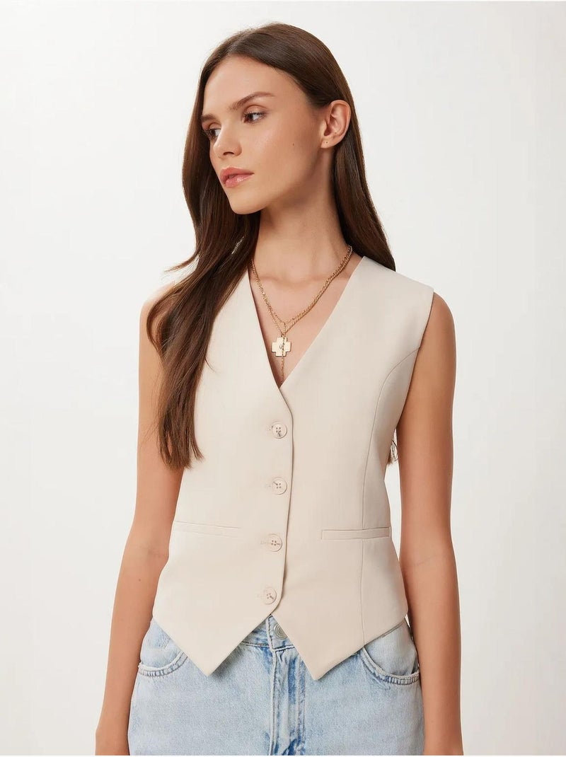 Ravissant gilet court boutonné à col en v istanbul Crème - Kiabi